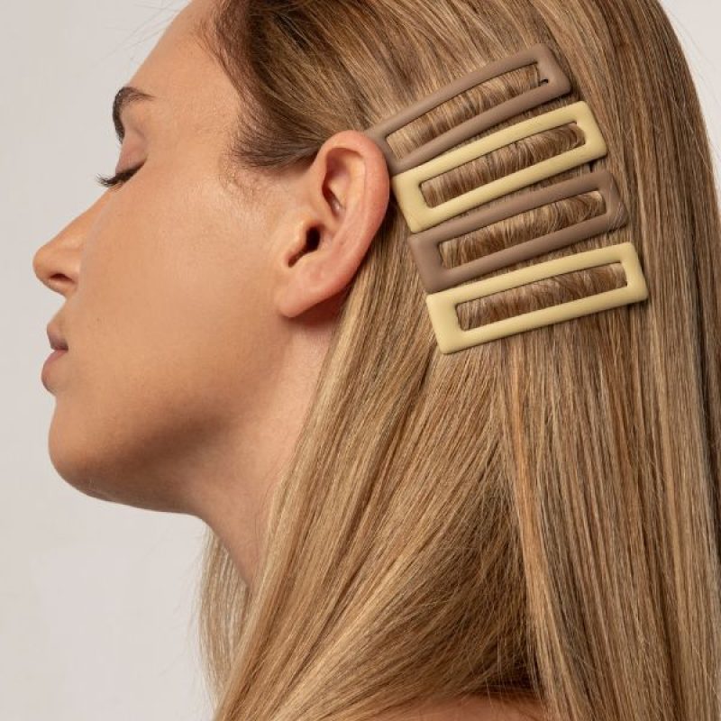 Blonde client with hair clips during a personalized in-salon experience